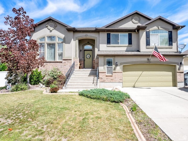 980 Woodstock Dr, North Salt Lake, UT 84054 - view of front of property with stucco siding, a garage, a front yard, and driveway
