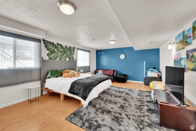 980 Woodstock Dr, North Salt Lake, UT 84054 - bedroom with wood finished floors and baseboards