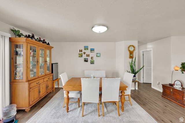 980 Woodstock Dr, North Salt Lake, UT 84054 - dining space featuring light wood-type flooring and baseboards