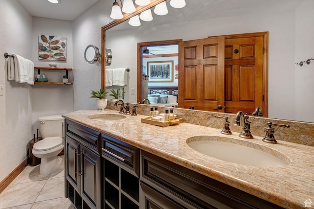 3000 Canyons Resort Dr Unit 3716, Park City, UT 84098 - ensuite bathroom featuring toilet, double vanity, tile patterned flooring, a ceiling fan, and baseboards