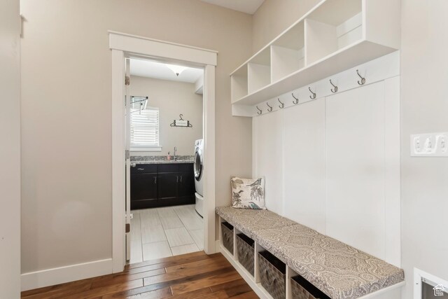 9288 N Harmony Way, Eagle Mountain, UT 84005 - mudroom featuring wood finished floors, a sink, and baseboards