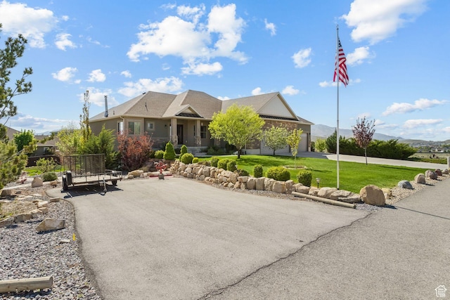 9288 N Harmony Way, Eagle Mountain, UT 84005 - view of front facade with curved driveway and a front lawn