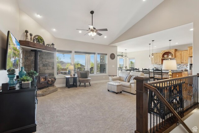 9288 N Harmony Way, Eagle Mountain, UT 84005 - living room with a ceiling fan, light colored carpet, a wood stove, recessed lighting, and baseboards