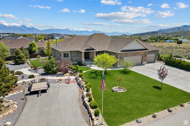 9288 N Harmony Way, Eagle Mountain, UT 84005 - single story home with an attached garage, a mountain view, concrete driveway, and a shingled roof