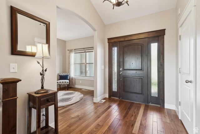9288 N Harmony Way, Eagle Mountain, UT 84005 - entryway with arched walkways, hardwood / wood-style floors, and baseboards