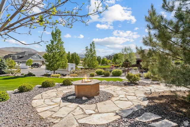 9288 N Harmony Way, Eagle Mountain, UT 84005 - view of grassy yard featuring an outdoor fire pit