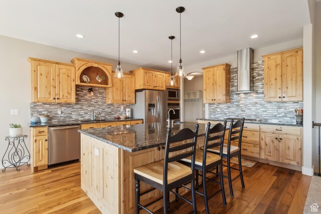 9288 N Harmony Way, Eagle Mountain, UT 84005 - kitchen featuring stainless steel appliances, wall chimney exhaust hood, light brown cabinetry, and recessed lighting