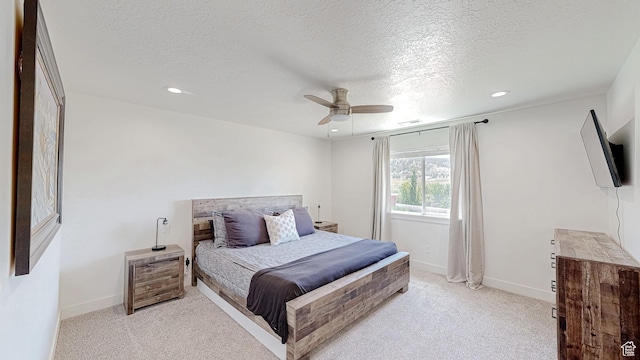 bedroom with light carpet, recessed lighting, a textured ceiling, a ceiling fan, and baseboards