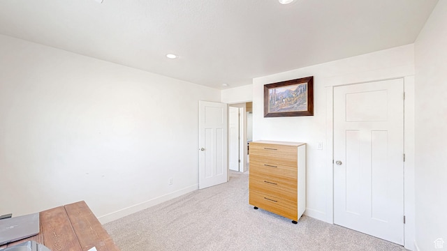 bedroom featuring light colored carpet, baseboards, and recessed lighting