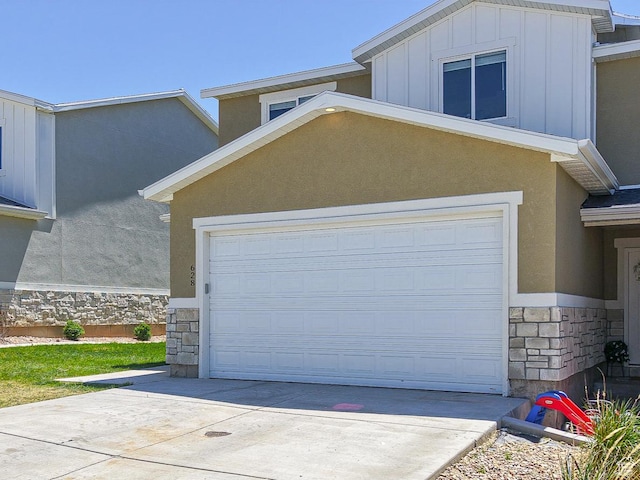 garage with concrete driveway