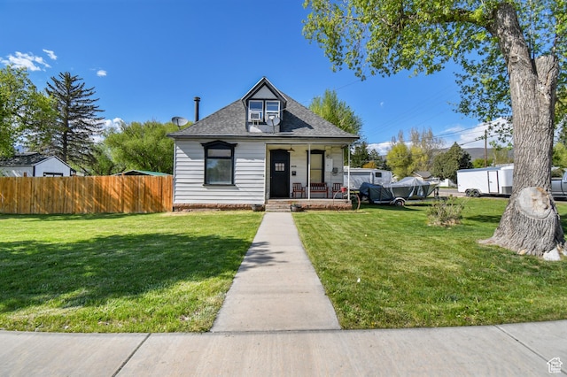 bungalow-style home featuring a porch and roof with shingles