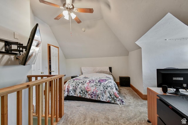 bedroom with carpet, lofted ceiling, baseboards, and ceiling fan