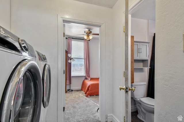 laundry area featuring washer and dryer, carpet flooring, baseboards, a textured wall, and ceiling fan