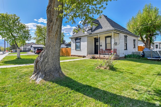 bungalow-style home with a porch and a shingled roof