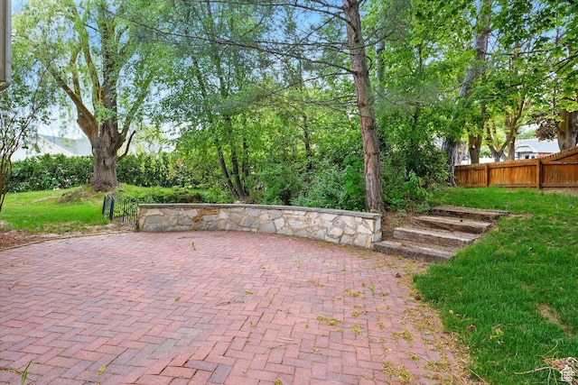 view of patio / terrace featuring fence
