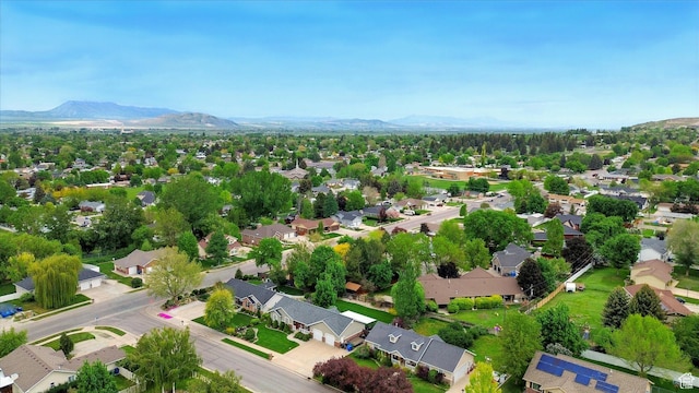aerial view of residential area featuring a mountainous background