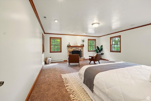 carpeted bedroom featuring a baseboard heating unit, crown molding, baseboards, baseboard heating, and a stone fireplace