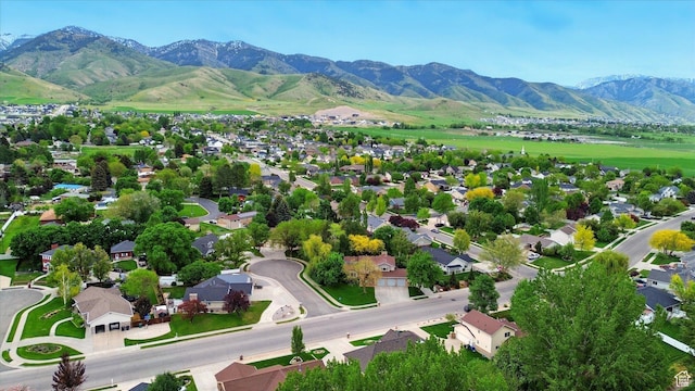 aerial view of residential area featuring a mountain backdrop