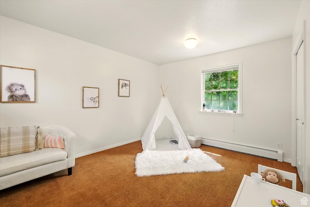 playroom with a baseboard radiator, carpet, and baseboards