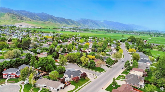 aerial view of residential area featuring a mountain backdrop