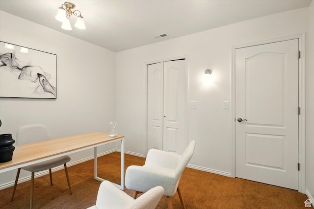 carpeted office space with baseboards