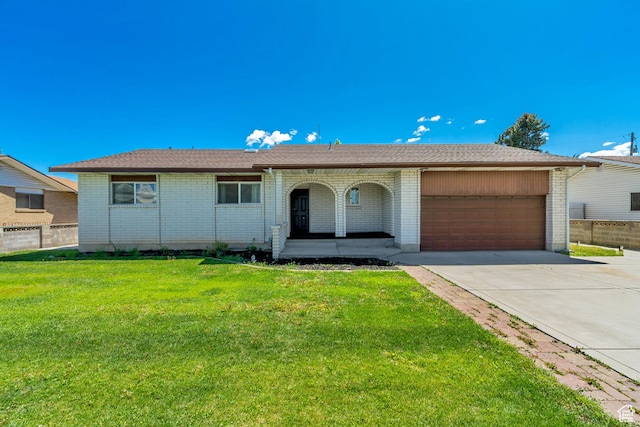 1145 S 350 W, Orem, UT 84058 - single story home featuring a garage, brick siding, driveway, and covered porch