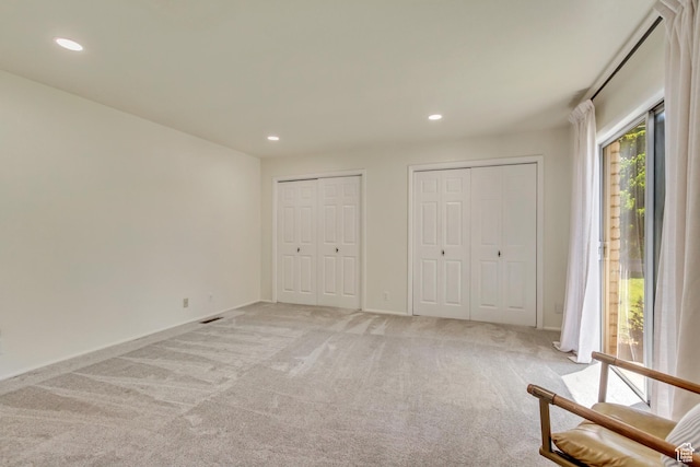 1145 S 350 W, Orem, UT 84058 - unfurnished bedroom with light carpet, two closets, recessed lighting, access to outside, and baseboards