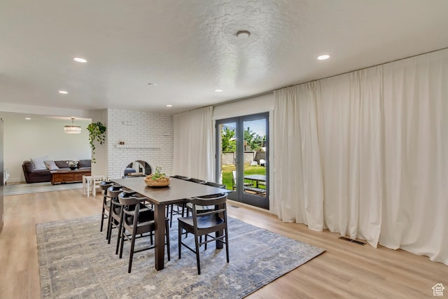 1145 S 350 W, Orem, UT 84058 - dining space featuring a fireplace, light wood finished floors, and recessed lighting