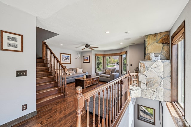 living room featuring wood finished floors, ceiling fan, recessed lighting, stairway, and baseboards