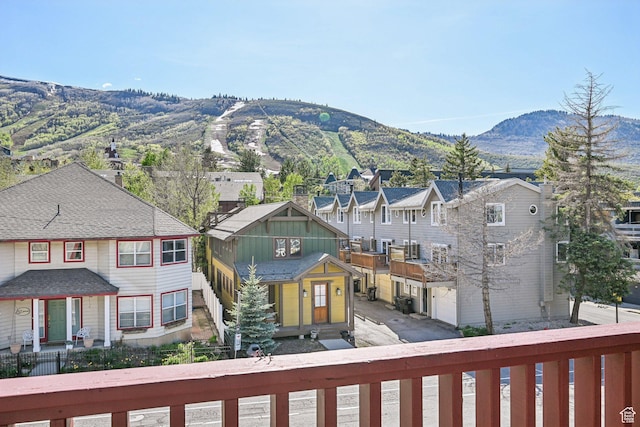 view of mountain backdrop with nearby suburban area