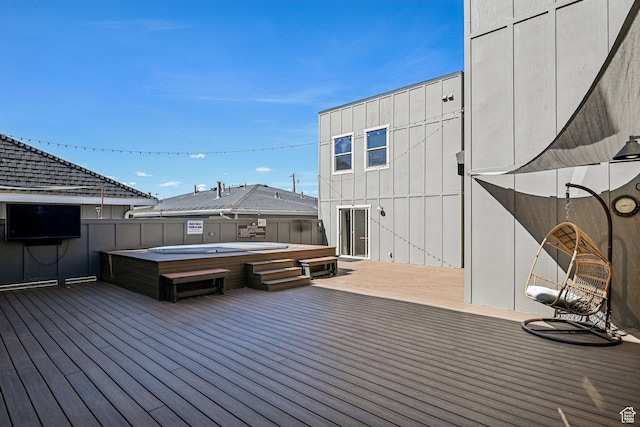 deck with a hot tub