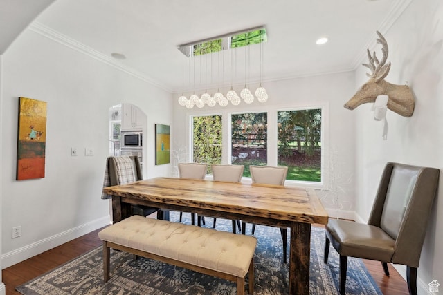 3339 W Big Spruce Way, Park City, UT 84098 - dining space featuring arched walkways, baseboards, dark wood-type flooring, ornamental molding, and recessed lighting