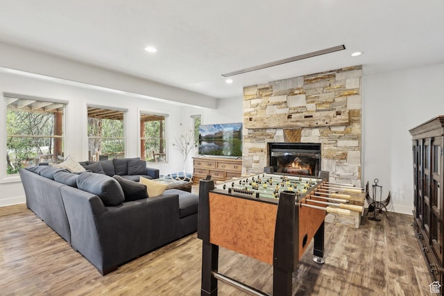 3339 W Big Spruce Way, Park City, UT 84098 - living area with wood finished floors, a stone fireplace, recessed lighting, and baseboards
