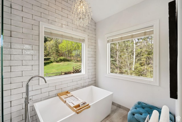 3339 W Big Spruce Way, Park City, UT 84098 - bathroom with a soaking tub, vaulted ceiling, a chandelier, and baseboards