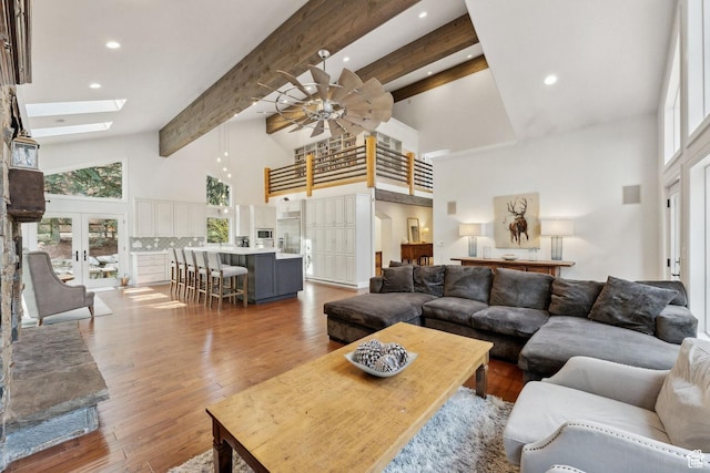 3339 W Big Spruce Way, Park City, UT 84098 - living room featuring high vaulted ceiling, a skylight, a ceiling fan, beam ceiling, and recessed lighting