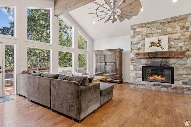 3339 W Big Spruce Way, Park City, UT 84098 - living area with high vaulted ceiling, a stone fireplace, hardwood / wood-style flooring, beam ceiling, and ceiling fan