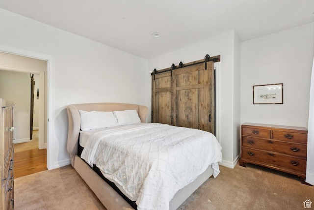 3339 W Big Spruce Way, Park City, UT 84098 - bedroom featuring light colored carpet, baseboards, and a barn door