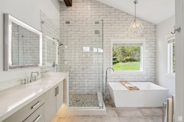 3339 W Big Spruce Way, Park City, UT 84098 - bathroom featuring a stall shower, vaulted ceiling, vanity, a freestanding tub, and tile patterned flooring
