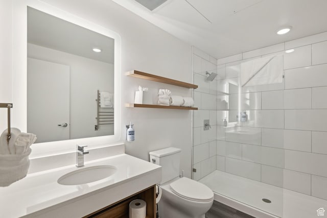 2670 Canyons Resort Dr Unit 238, Park City, UT 84098 - bathroom with toilet, a tile shower, vanity, a towel warming rack, and recessed lighting
