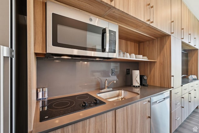 2670 Canyons Resort Dr Unit 238, Park City, UT 84098 - kitchen with appliances with stainless steel finishes, modern cabinets, a sink, and light brown cabinets