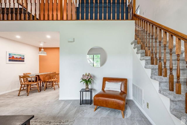 447 W 1175 N, Centerville, UT 84014 - living area featuring carpet flooring, stairway, a high ceiling, and baseboards
