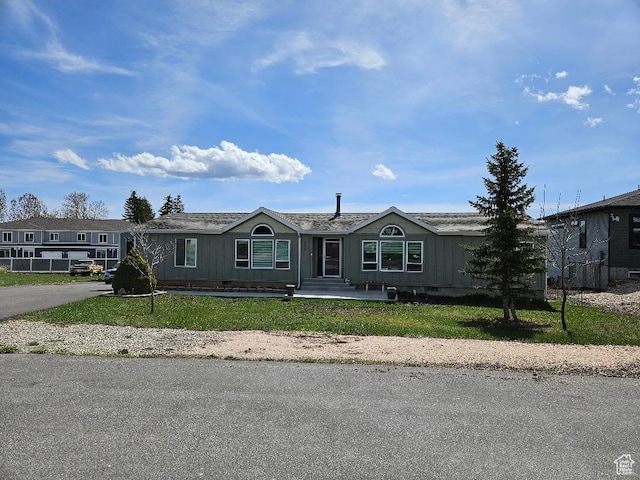 550 S Stump Hollow Rd, Garden City, UT 84028 - manufactured / mobile home with a front lawn