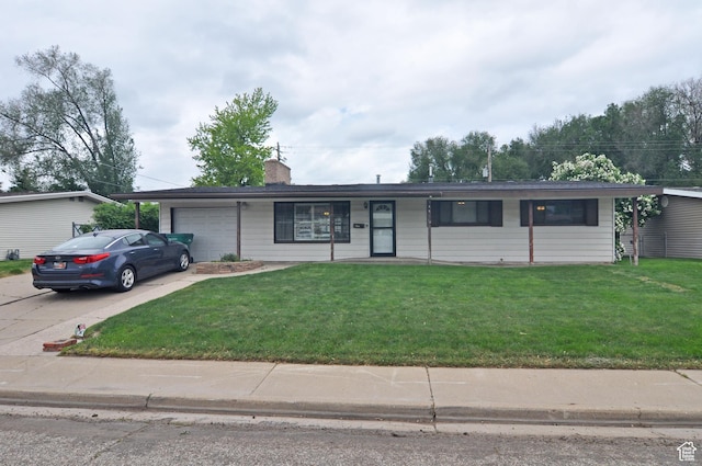 ranch-style house with an attached garage, driveway, a front lawn, and a chimney