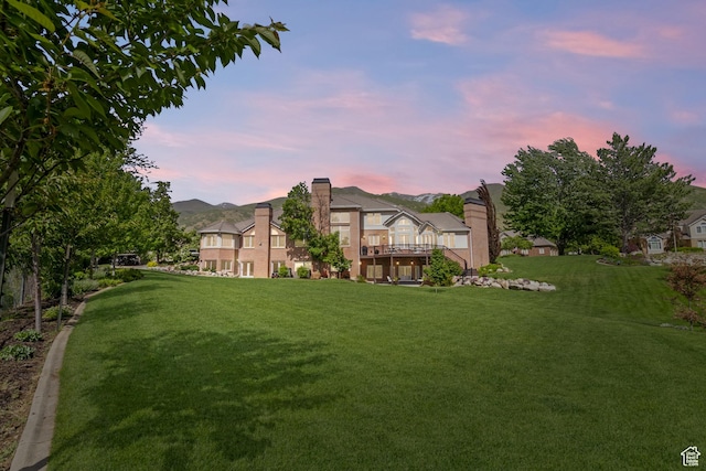 1971 Summerwood Dr, Farmington, UT 84025 - yard at dusk with a yard and a wooden deck
