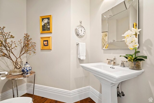 1971 Summerwood Dr, Farmington, UT 84025 - half bathroom featuring baseboards, wood finished floors, and a sink