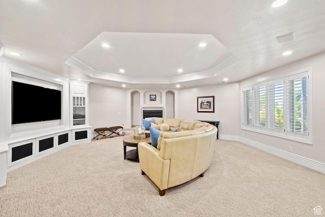 1971 Summerwood Dr, Farmington, UT 84025 - living room with arched walkways, light colored carpet, recessed lighting, a raised ceiling, and crown molding