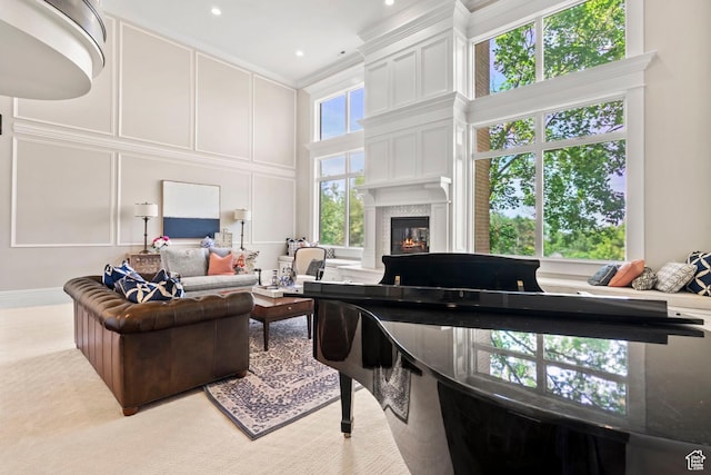 1971 Summerwood Dr, Farmington, UT 84025 - living area with a high ceiling, a premium fireplace, ornamental molding, a decorative wall, and recessed lighting