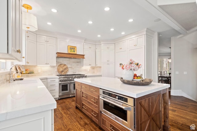 1971 Summerwood Dr, Farmington, UT 84025 - kitchen featuring appliances with stainless steel finishes, a sink, dark wood-type flooring, white cabinets, and recessed lighting