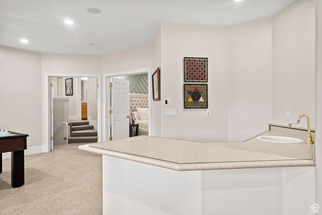 1971 Summerwood Dr, Farmington, UT 84025 - kitchen with carpet, a sink, a peninsula, recessed lighting, and light countertops