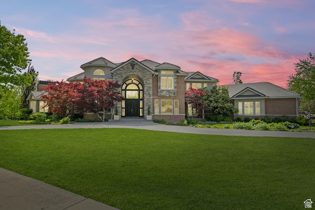 1971 Summerwood Dr, Farmington, UT 84025 - view of front of house with a front lawn, concrete driveway, and stucco siding